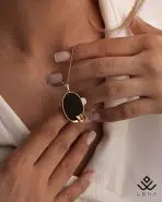 آویز طلا بیضی مشکی با پروانه - Image 3