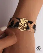 دستبند طلا و میوکی پلنگی با پلاک گل ارکیده - Image 2