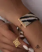 دستبند طلا و میوکی زبرا با آویز گل اسلیمی - Image 2